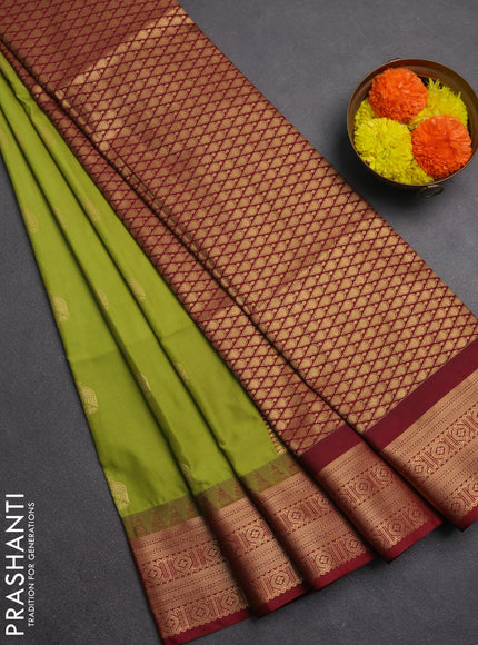 Semi soft silk saree green and maroon with zari woven buttas and temple design zari woven border