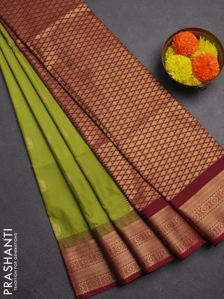 Semi soft silk saree green and maroon with zari woven buttas and temple design zari woven border