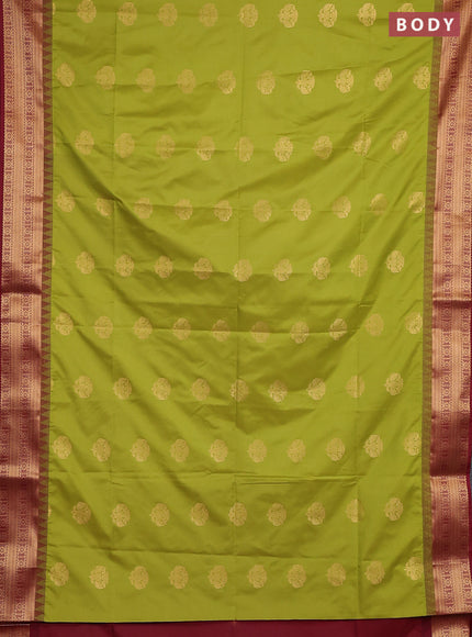 Semi soft silk saree green and maroon with zari woven buttas and temple design zari woven border