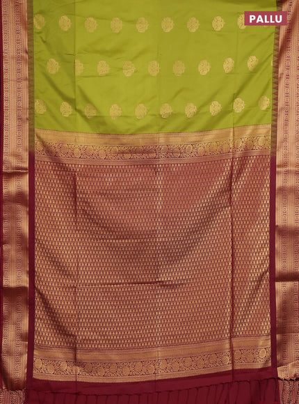 Semi soft silk saree green and maroon with zari woven buttas and temple design zari woven border