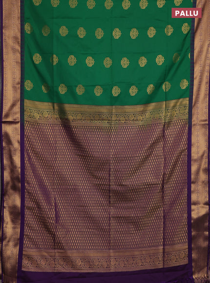 Semi soft silk saree green and purple with zari woven buttas and temple design zari woven border