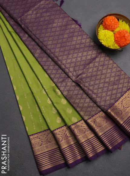 Semi soft silk saree green and purple with allover zari woven buttas and zari woven border