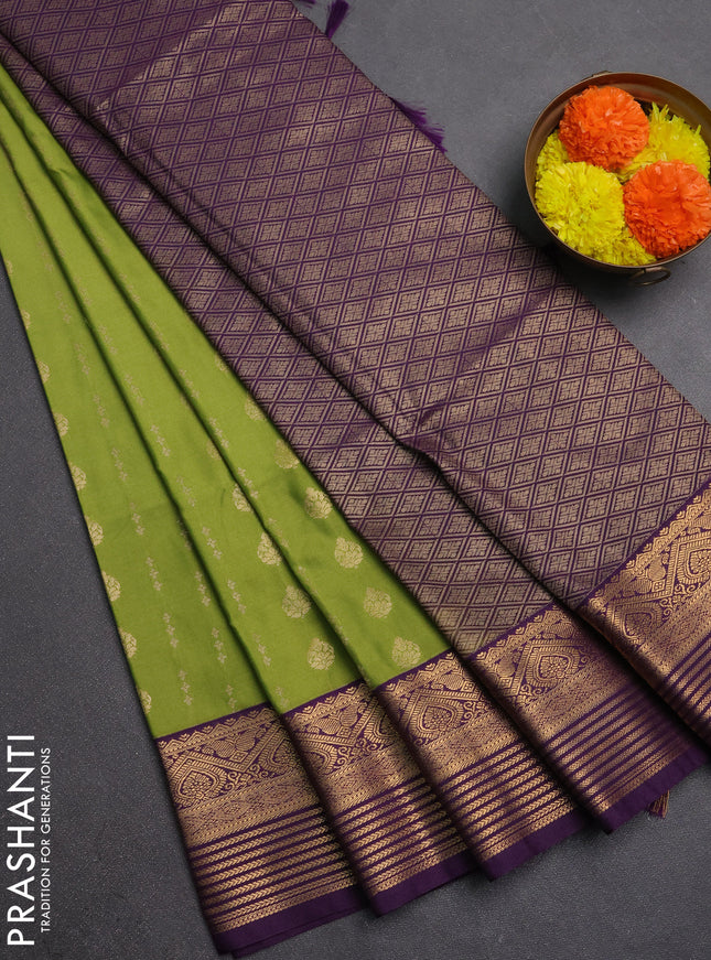 Semi soft silk saree green and purple with allover zari woven buttas and zari woven border
