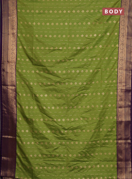 Semi soft silk saree green and purple with allover zari woven buttas and zari woven border