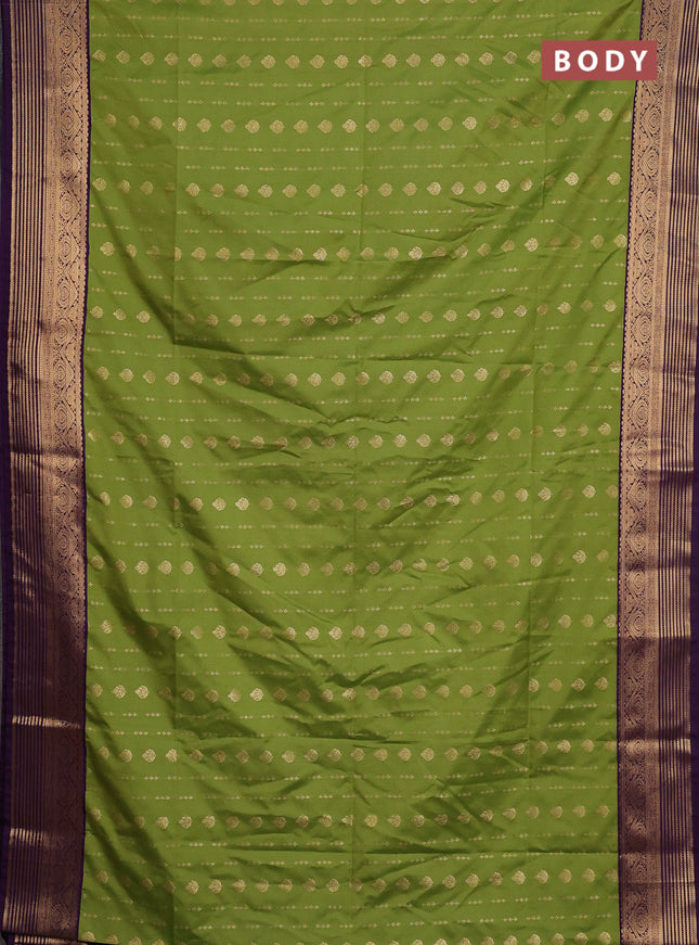 Semi soft silk saree green and purple with allover zari woven buttas and zari woven border