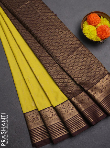 Semi soft silk saree yellow and coffee brown with allover zari woven buttas and zari woven border