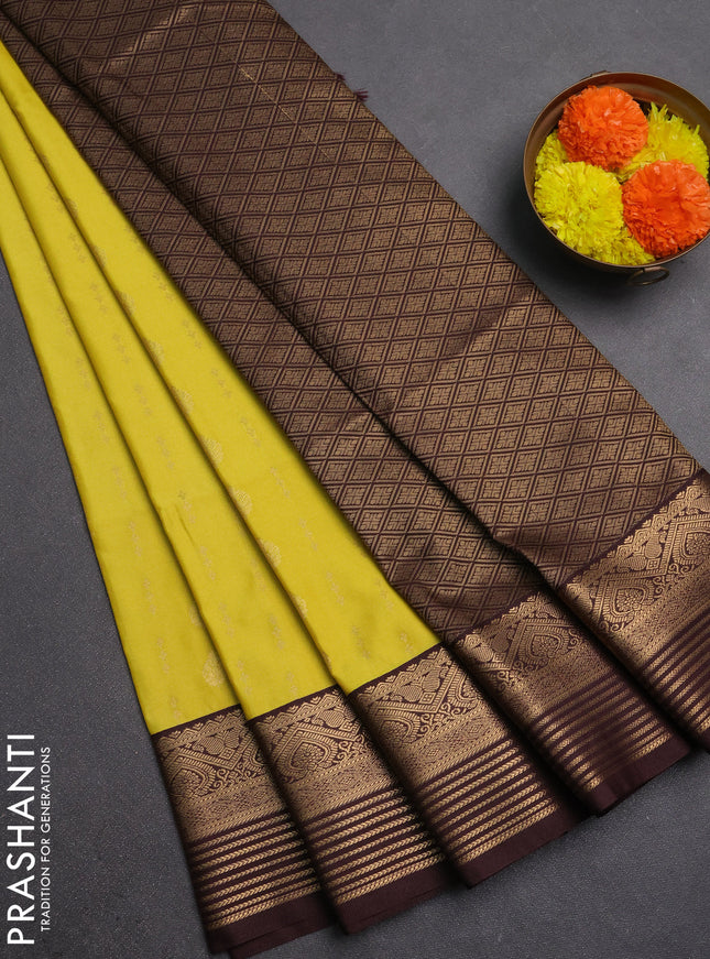 Semi soft silk saree yellow and coffee brown with allover zari woven buttas and zari woven border