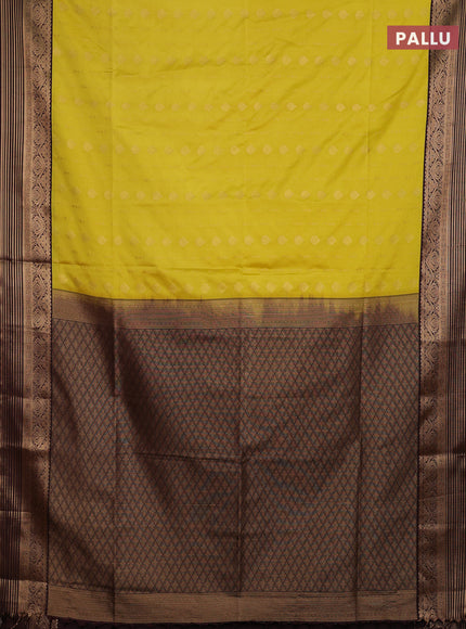 Semi soft silk saree yellow and coffee brown with allover zari woven buttas and zari woven border