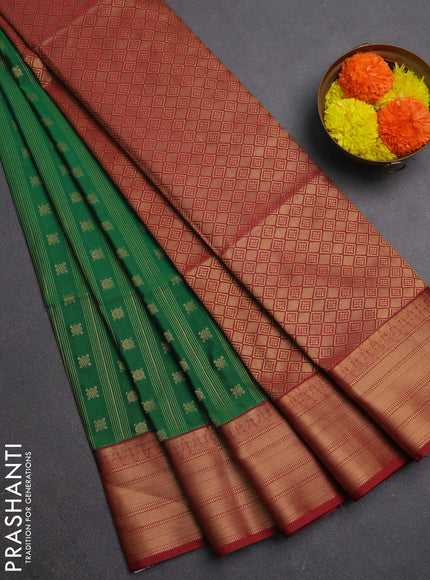 Semi soft silk saree green and maroon with allover zari weaves & buttas and zari woven border