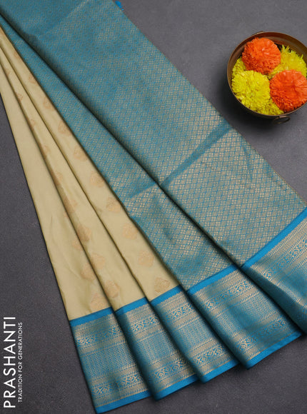 Semi soft silk saree beige and teal blue with zari woven butta border and zari woven border