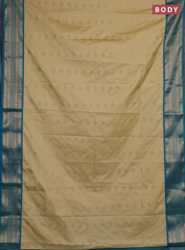 Semi soft silk saree beige and teal blue with zari woven butta border and zari woven border