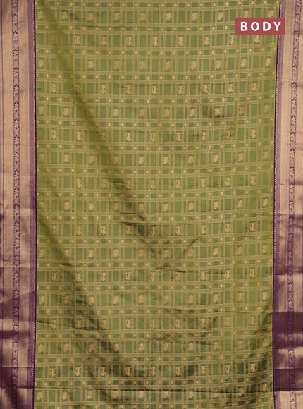 Semi soft silk saree green and purple with allover zari checks & buttas and zari woven border