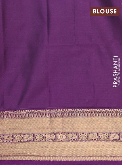 Semi soft silk saree green and purple with allover zari checks & buttas and zari woven border