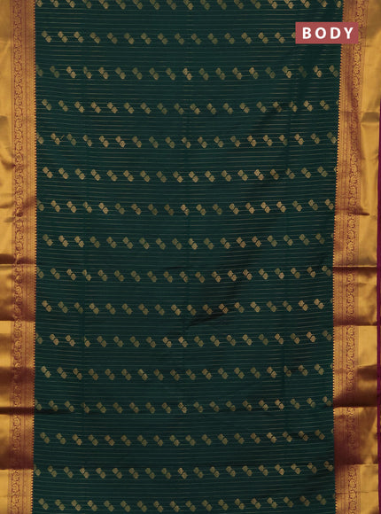 Semi soft silk saree bottle green and magenta pink with allover zari weaves & buttas and rich zari woven border