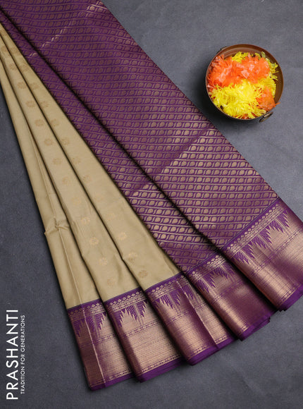 Semi soft silk saree elachi green and purple with allover zari woven buttas and zari woven border