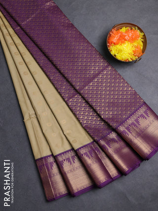 Semi soft silk saree elachi green and purple with allover zari woven buttas and zari woven border