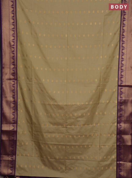 Semi soft silk saree elachi green and purple with allover zari woven buttas and zari woven border