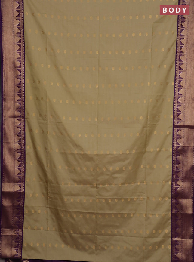 Semi soft silk saree elachi green and purple with allover zari woven buttas and zari woven border