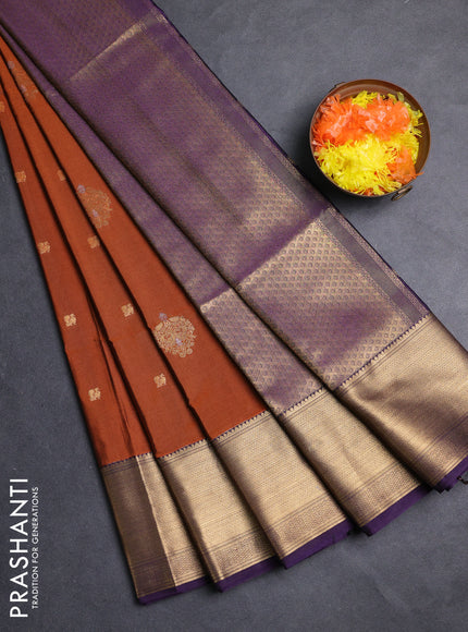 Semi soft silk saree rust shade and purple with allover zari woven buttas and zari woven border