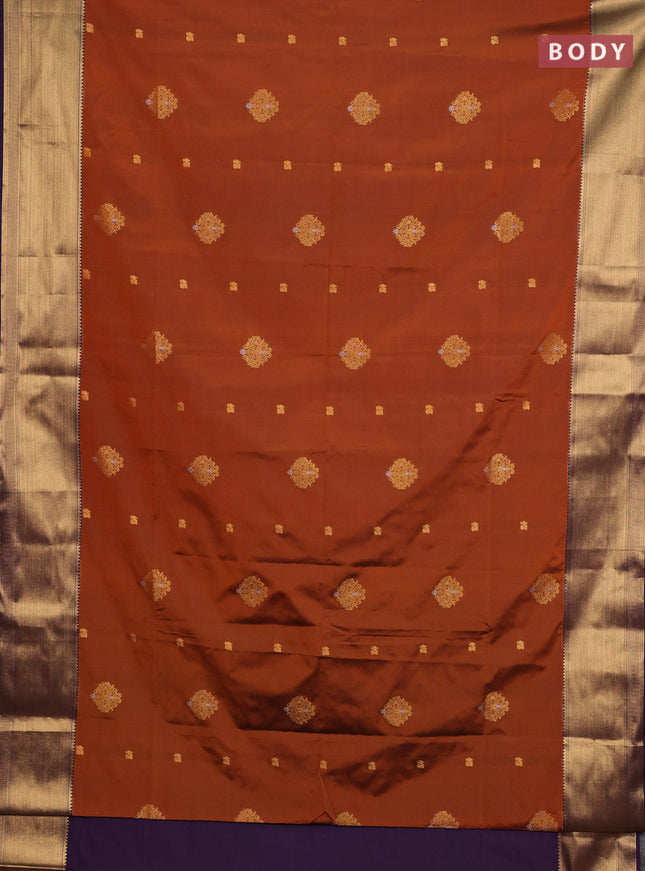 Semi soft silk saree rust shade and purple with allover zari woven buttas and zari woven border