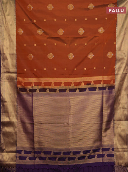 Semi soft silk saree rust shade and purple with allover zari woven buttas and zari woven border