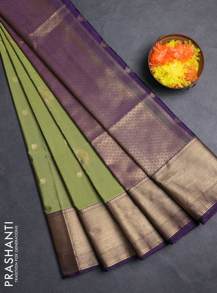 Semi soft silk saree mehendi green and purple with allover zari woven buttas and zari woven border
