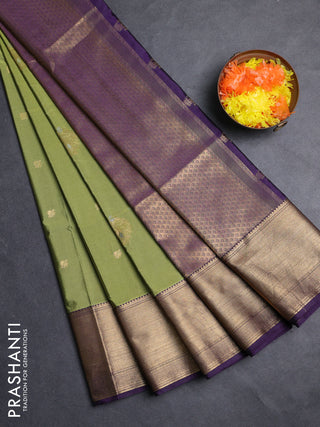 Semi soft silk saree mehendi green and purple with allover zari woven buttas and zari woven border