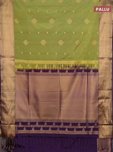 Semi soft silk saree mehendi green and purple with allover zari woven buttas and zari woven border