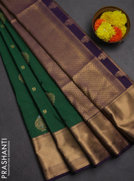 Semi soft silk saree dark green and purple with allover zari woven buttas and zari woven border