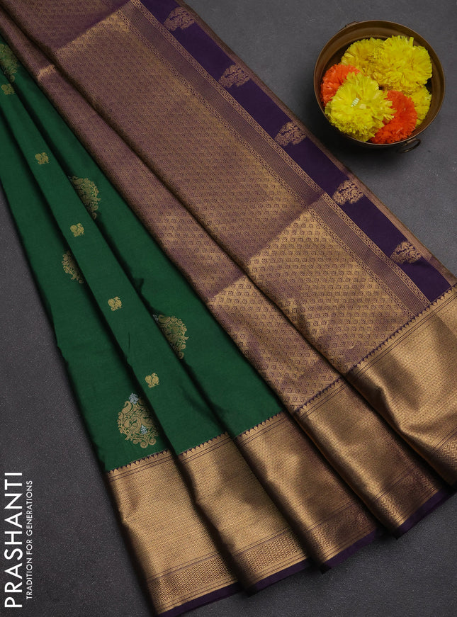 Semi soft silk saree dark green and purple with allover zari woven buttas and zari woven border