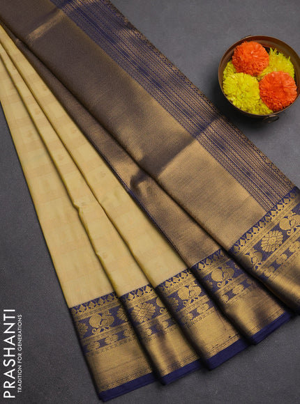 Semi soft silk saree pale yellow and navy blue with allover zari checks & buttas and rich zari woven border