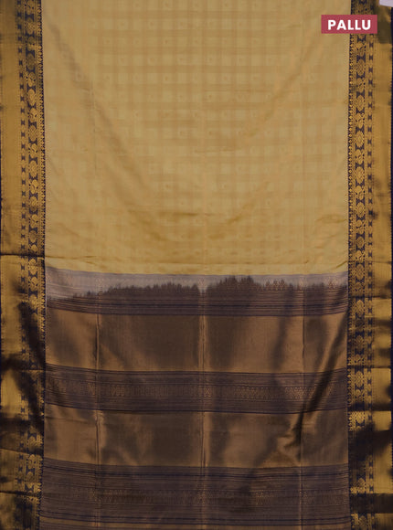 Semi soft silk saree pale yellow and navy blue with allover zari checks & buttas and rich zari woven border