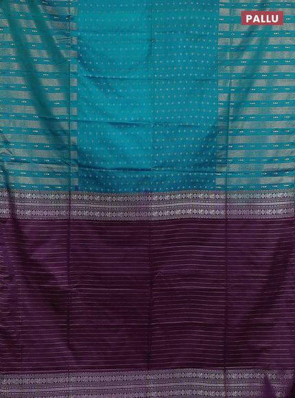 Semi soft silk saree teal green and purple with allover silver & gold zari woven buttas