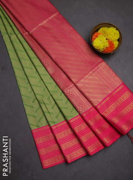 Semi soft silk saree green and pink with allover zari brocade weaves and zari woven border