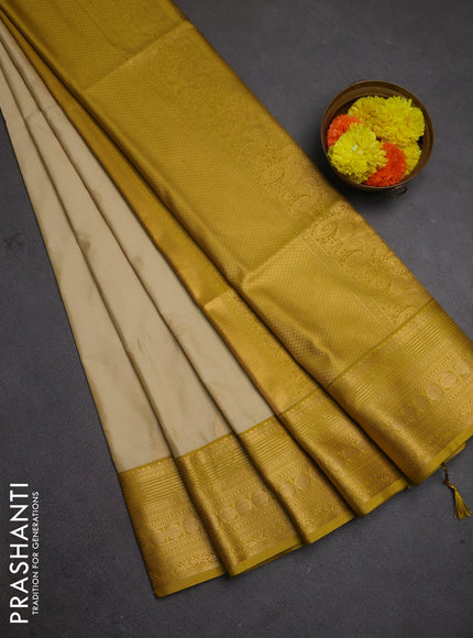 Semi soft silk saree beige and mustard yellow with allover zari woven buttas and zari woven border