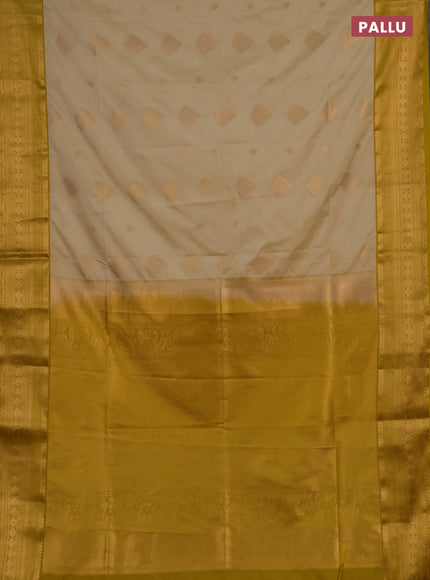Semi soft silk saree beige and mustard yellow with allover zari woven buttas and zari woven border