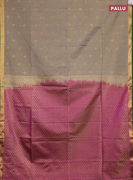 Semi soft silk saree grey shade and green magenta pink with allover zari checks & buttas and rich zari woven border