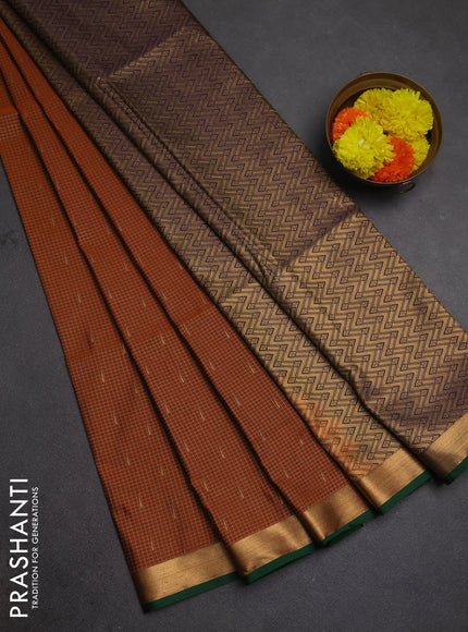 Semi soft silk saree rust shade and deep purple with allover small zari checks & buttas and zari woven border