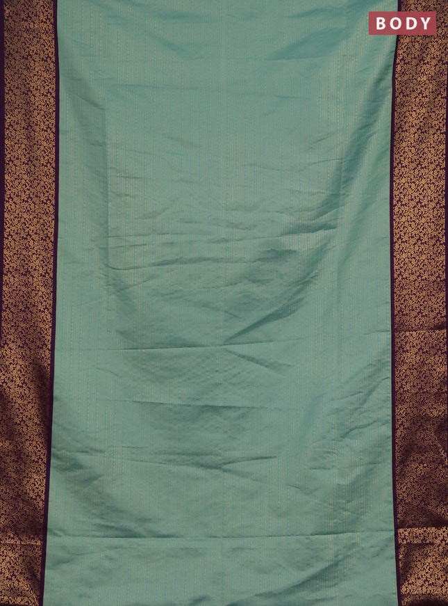 Semi soft silk saree teal green and purple with allover zari brocade weaves and zari woven border