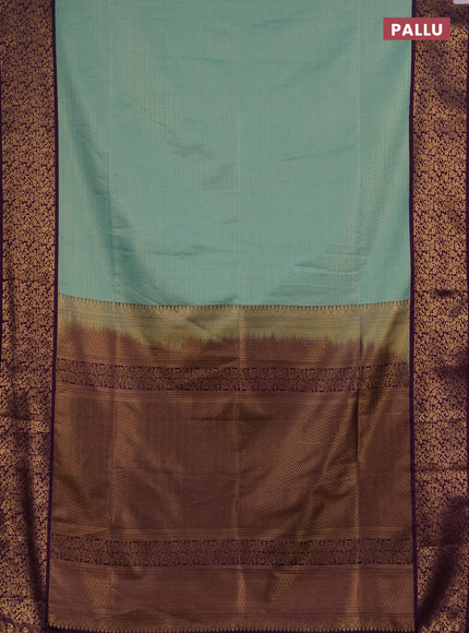 Semi soft silk saree teal green and purple with allover zari brocade weaves and zari woven border