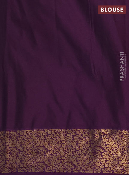 Semi soft silk saree teal green and purple with allover zari brocade weaves and zari woven border