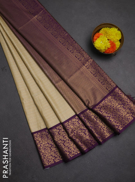 Semi soft silk saree beige and purple with allover zari brocade weaves and zari woven border