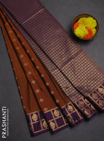 Semi soft silk saree dark mustard and purple with allover zari woven buttas and zari woven border