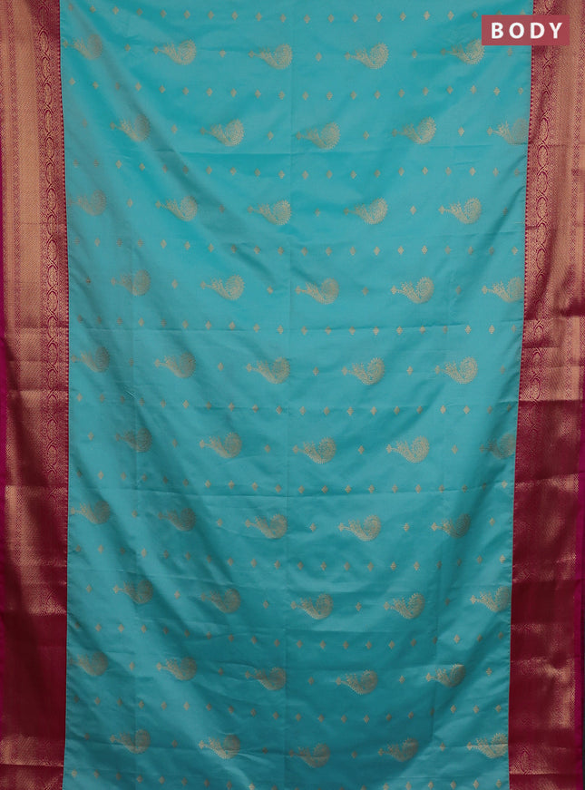 Semi soft silk saree teal blue and pink with allover zari woven buttas and zari woven border