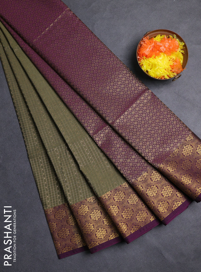 Semi soft silk saree olive green and purple with allover zari checks & buttas and zari woven border
