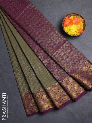 Semi soft silk saree olive green and purple with allover zari checks & buttas and zari woven border