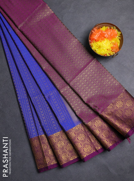 Semi soft silk saree blue and purple with allover zari checks & buttas and zari woven border