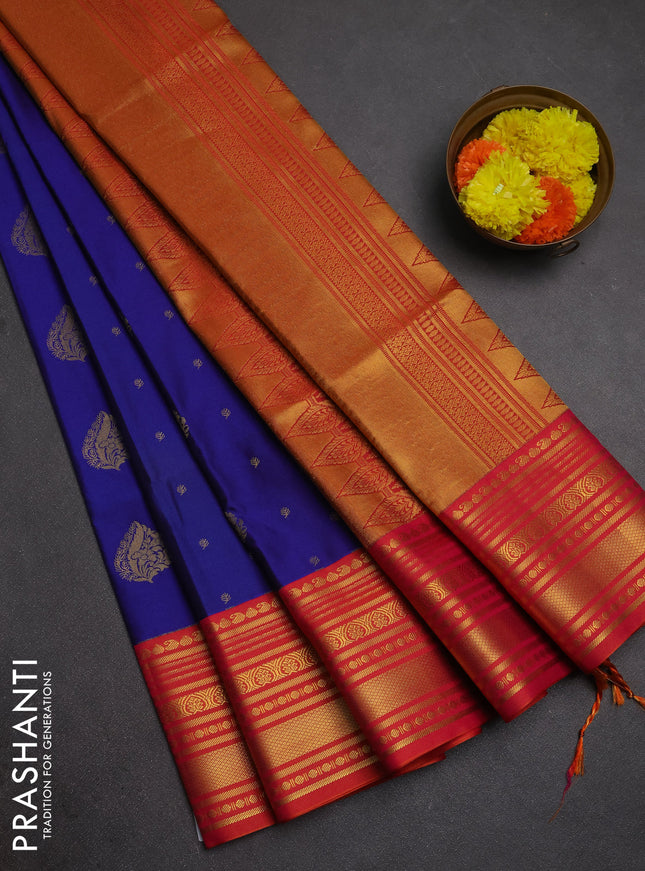 Semi soft silk saree blue and dual shade of pinkish orange with allover zari woven buttas and zari woven border