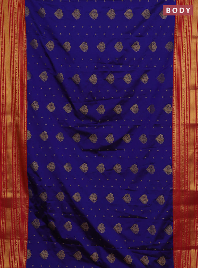 Semi soft silk saree blue and dual shade of pinkish orange with allover zari woven buttas and zari woven border