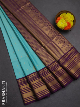 Semi soft silk saree teal shade and purple with allover zari woven buttas and zari woven border